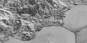 A portion of a 
										mountainous shoreline on Pluto obtained during the flyby of Pluto performed by the New Horizons 
										probe. Credit for the original image: NASA/Johns Hopkins University Applied Physics Laboratory/
										Southwest Research Institute.