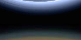 The upper atmosphere 
										of Titan compared to the atmosphere of Pluto at scale. Credit for the original image of Titan: 
										NASA/JPL-Caltech/Space Science Institute. Credit for the original view of Pluto: NASA/Johns 
										Hopkins University Applied Physics Laboratory/Southwest Research Institute. Montage credit: 
										Marc Lafferre, 2020.